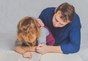 the dad and daughter do homework after primary school