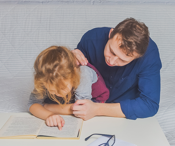 the dad and daughter do homework after primary school